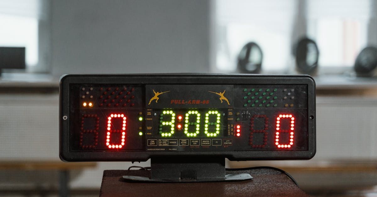 A digital scoreboard is sitting on top of a wooden table.