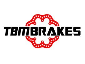 TBM BRAKES logo: black text with a red, flower-shaped pattern in the center.