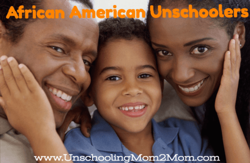 Family smiling, center boy, dark hair and skin, with mother and father. 