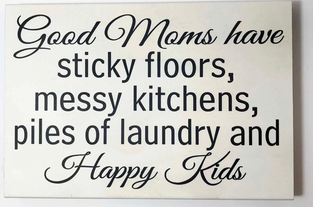 White sign with black text: