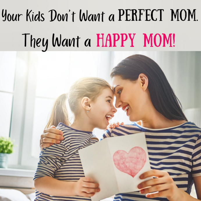 A woman and child embrace, smiling. The child holds a card with a pink heart. Text: