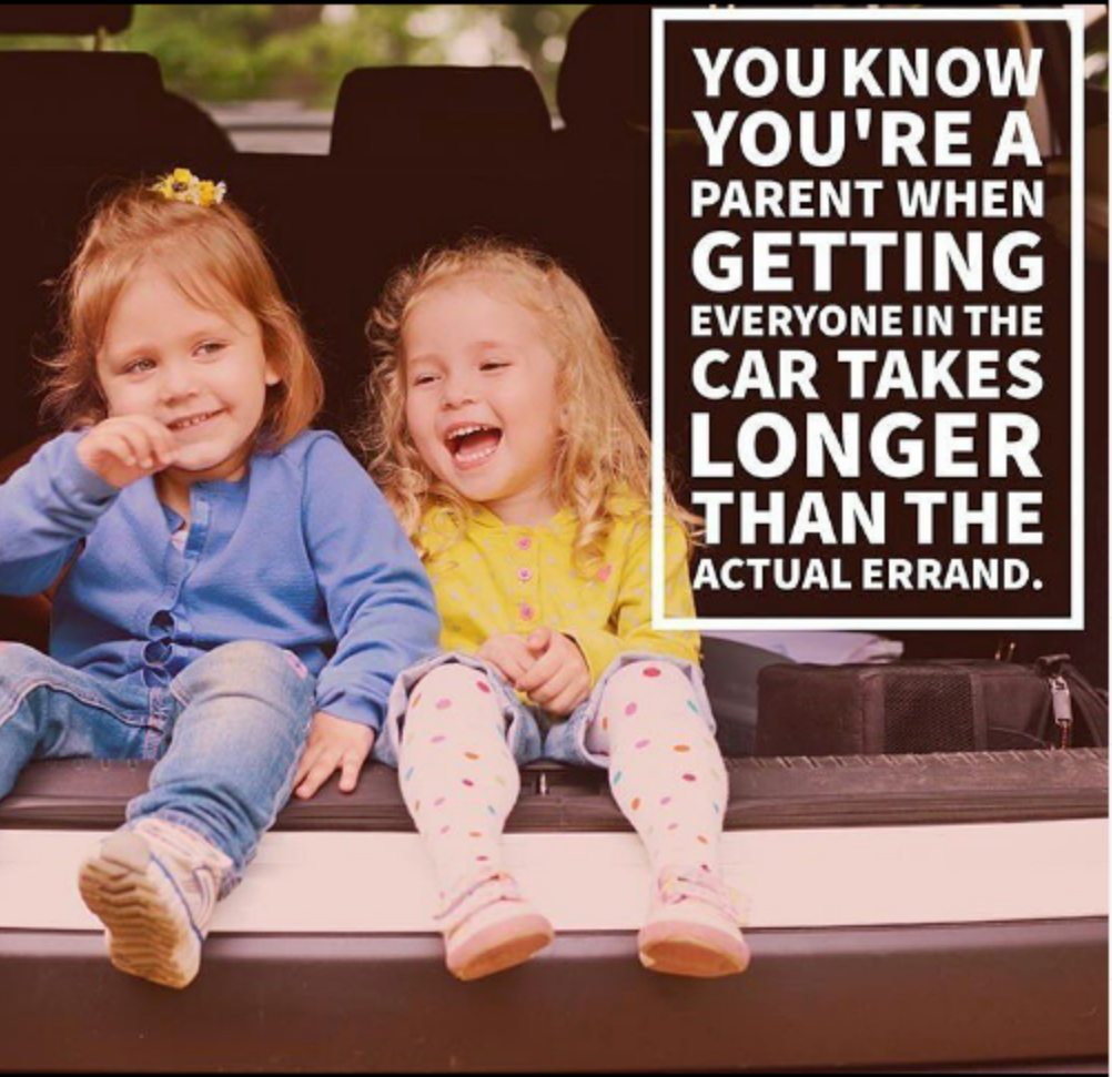 Two smiling children in a car trunk, the text says getting everyone in the car takes longer than the actual errand.