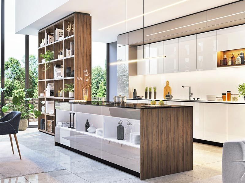 A modern kitchen featuring a dark wood island with white shelving, matching tall cabinetry, and open display shelving.