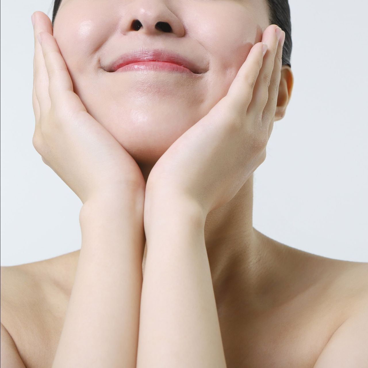 Close Up Of Woman With Hand On Face — Centerville, OH — Elegant Permanent Cosmetics & Skincare Close Up Of Woman With Hand On Face — Centerville, OH — Elegant Permanent Cosmetics & Skincare