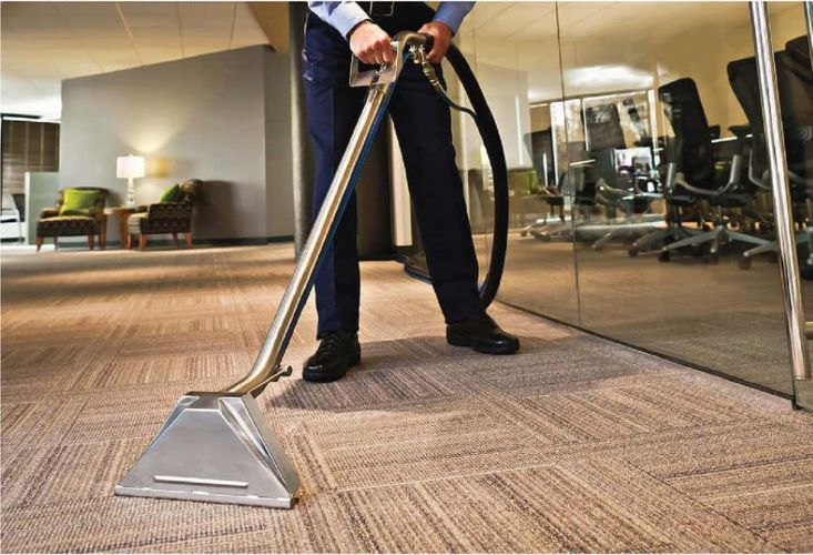 Man using a vacuum for Carpet cleaning