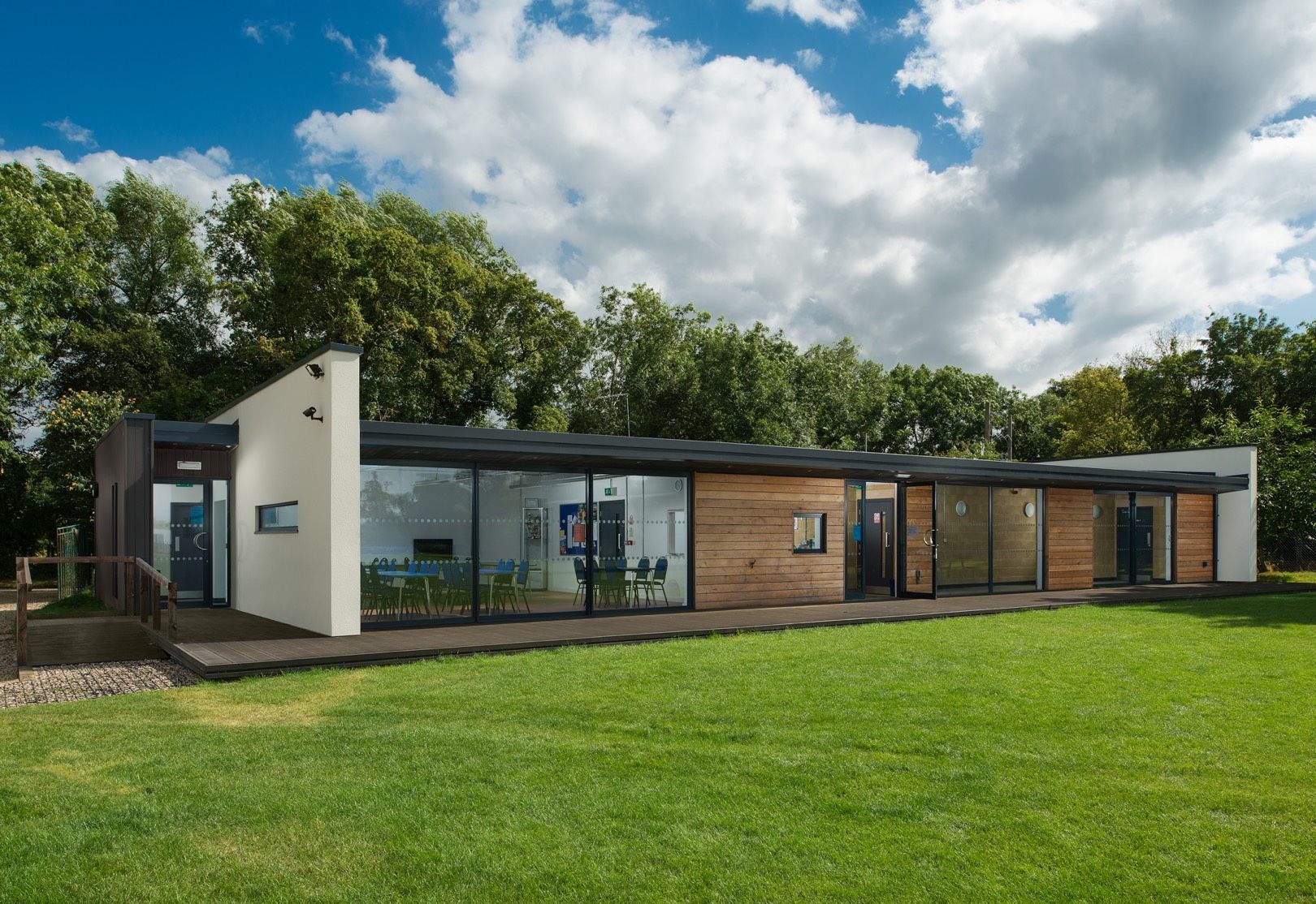 Littlemarsh Pavilion is sitting on top of a lush green field