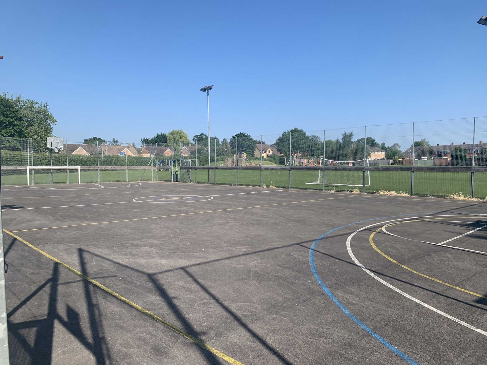 A basketball court with a blue line on the side of it