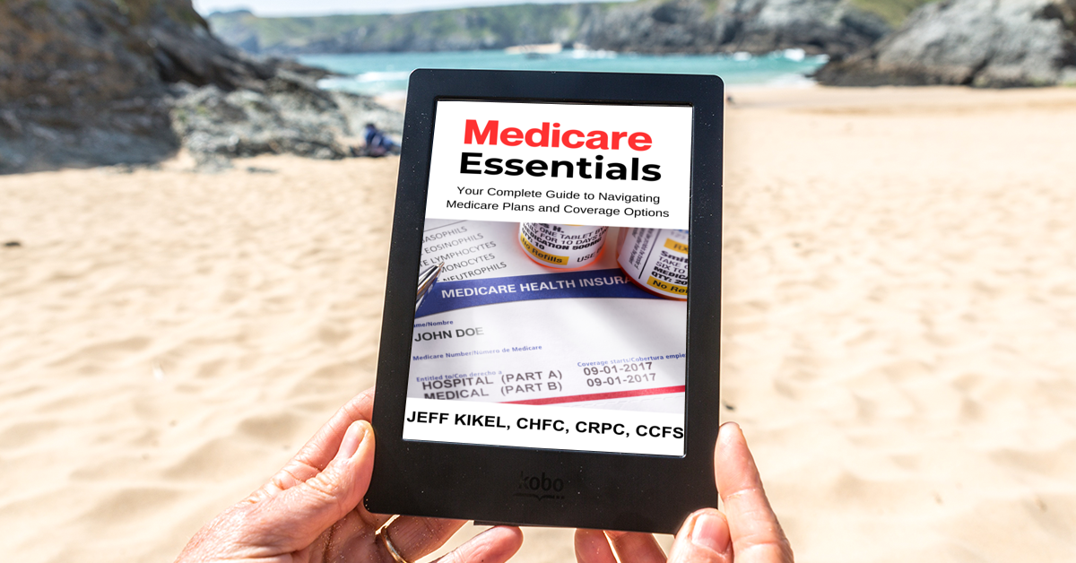 A person is holding a tablet that says medicare essentials on it.