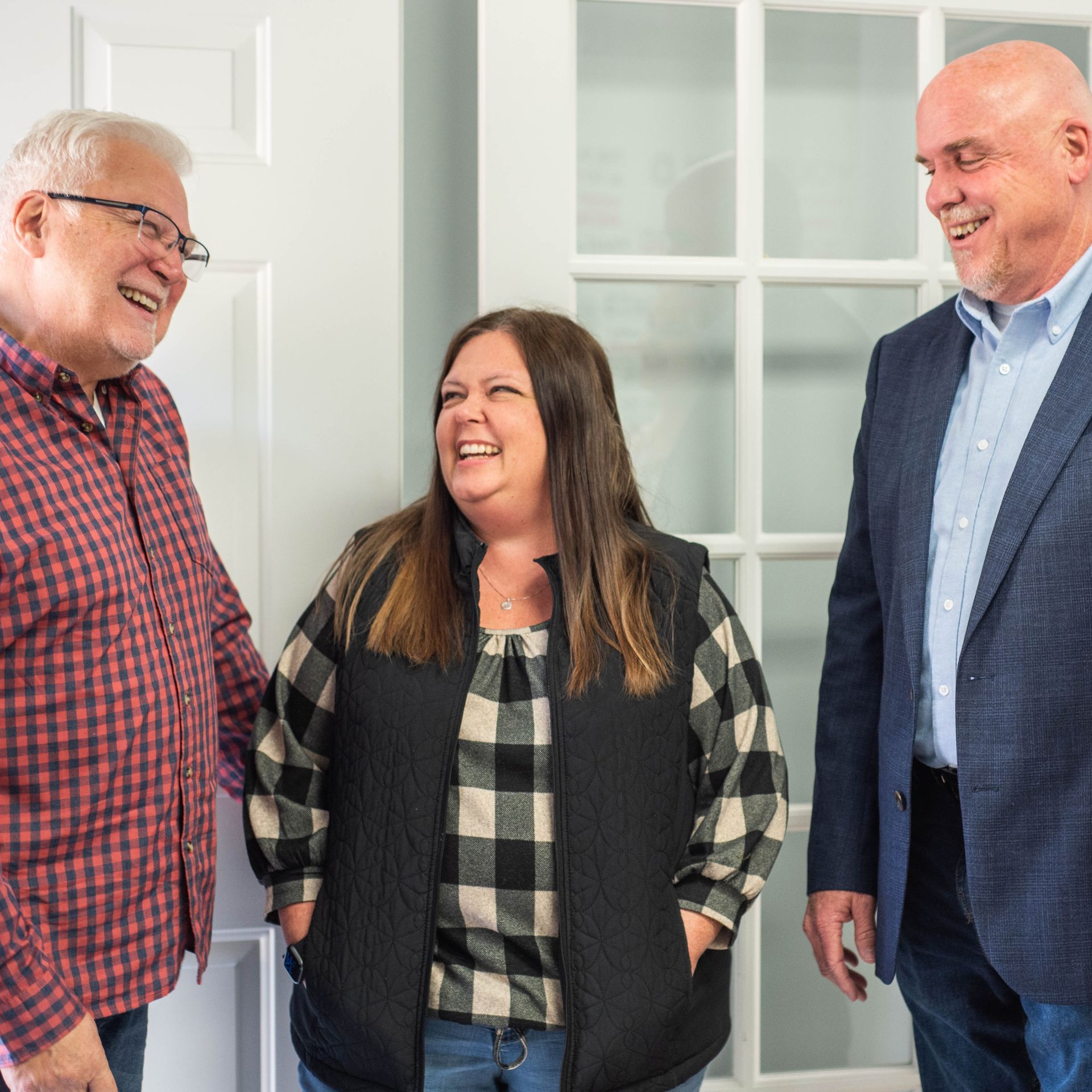 Ashley Lay Real Estate team members laughing together at a team event