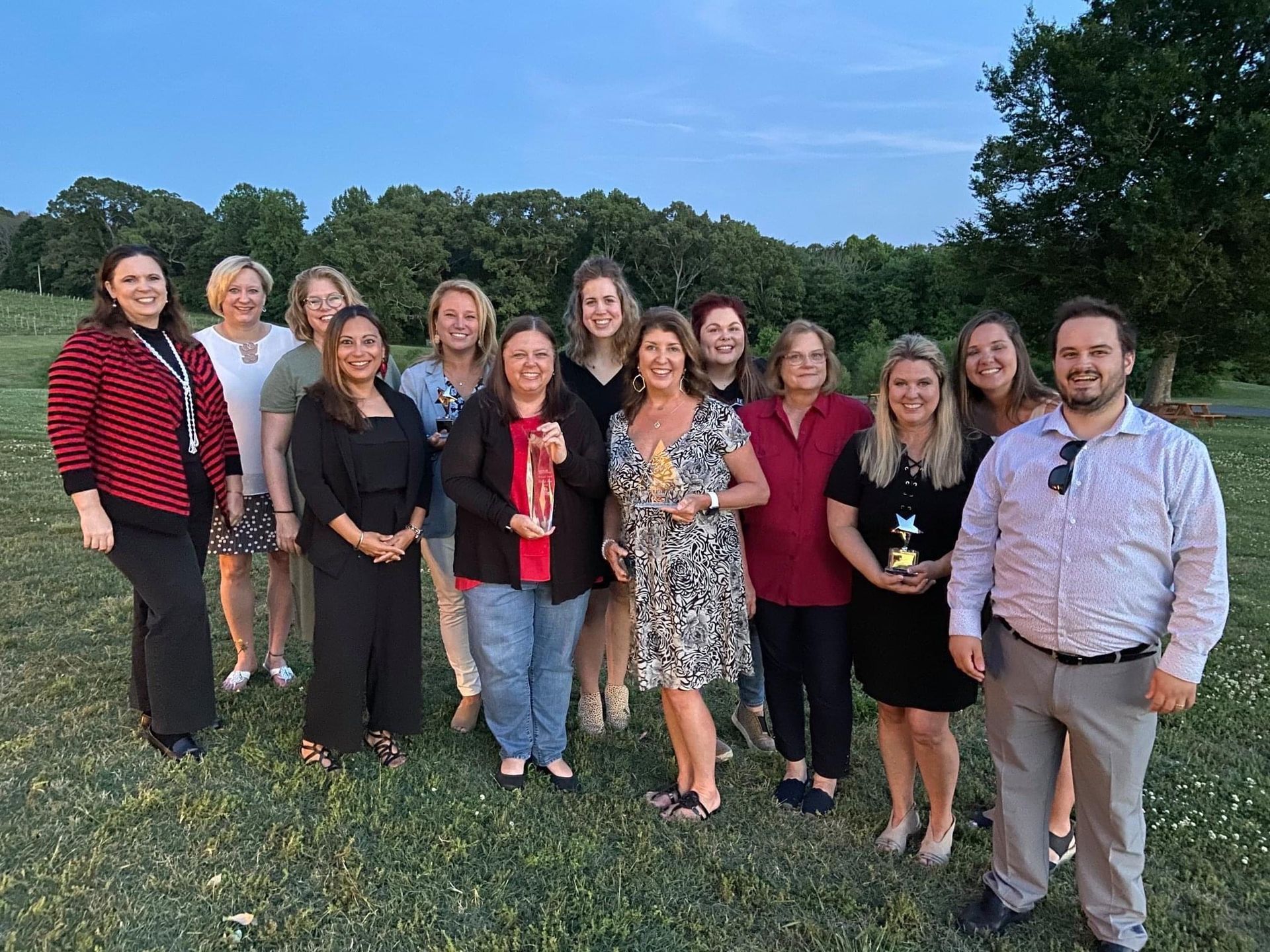 Ashley Lay Real Estate team gathered outdoors at a team event