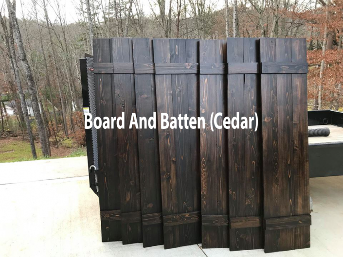 Dark cedar board-and-batten fence panels outdoors with text overlay