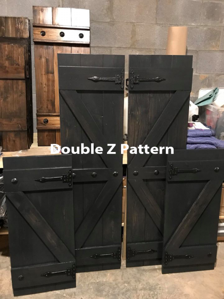 Black wooden cabinet panels with diagonal Z-brace doors in a workshop; text reads “Double Z Pattern.”