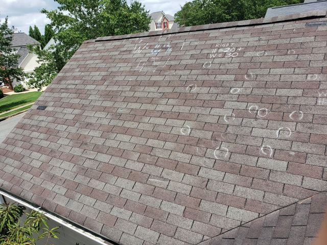 Roof with circle markings - Woodstock, GA | MTak Roofing Systems