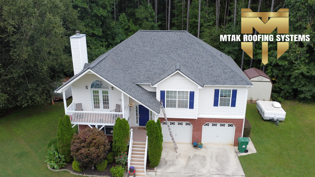 Top view of house besides woods - Woodstock, GA | MTak Roofing Systems