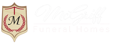 Gold shield logo with red laurel wreath and black “M” over faint “McNulty Funeral Homes” text