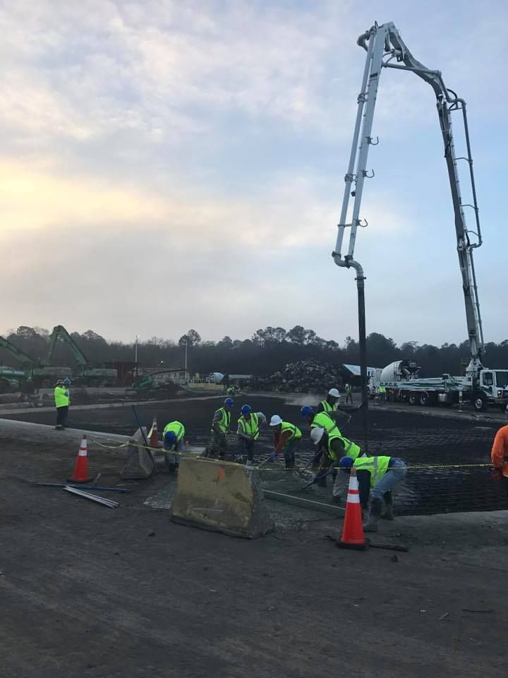 A group of construction workers are working on a construction site.