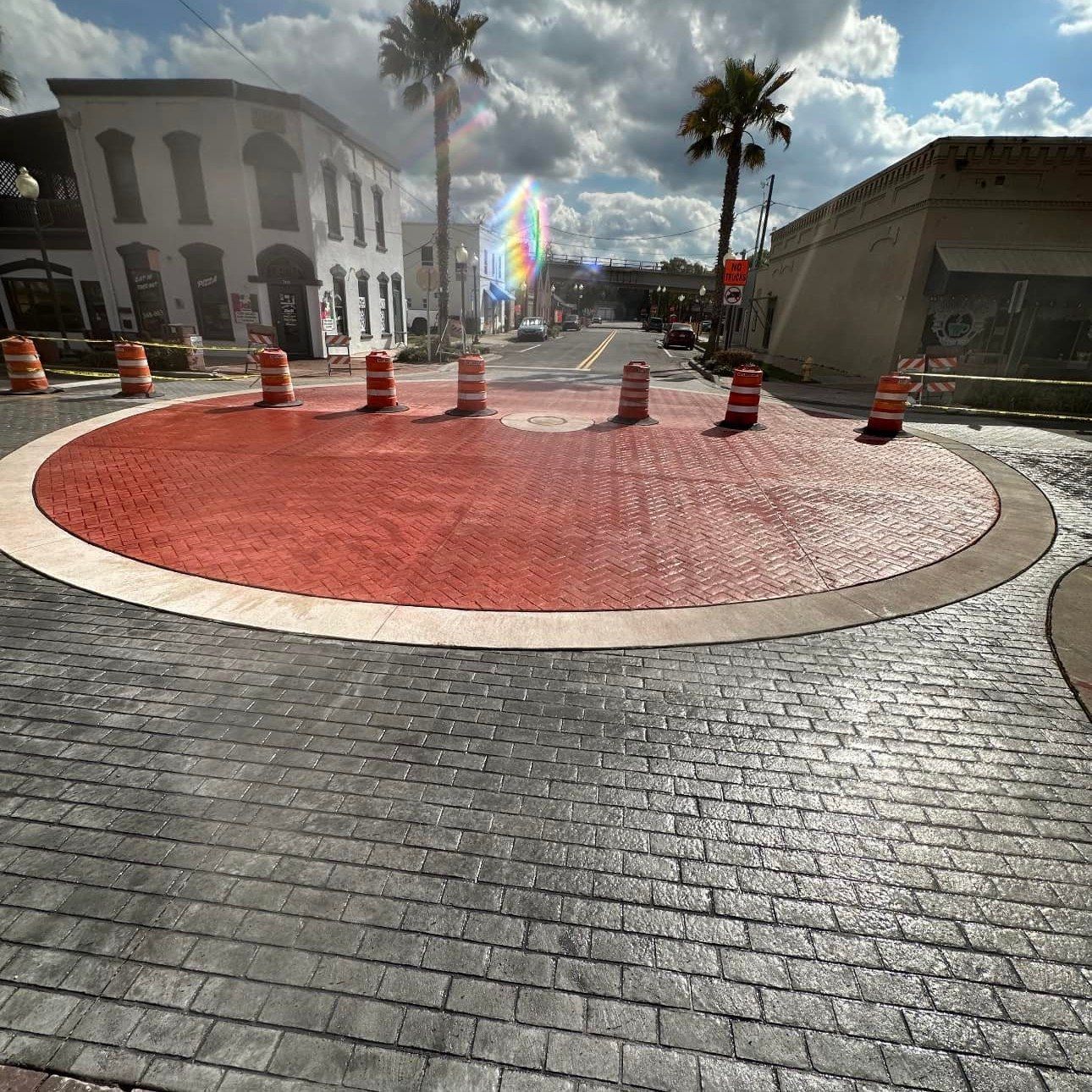 A roundabout with a red circle in the middle of it