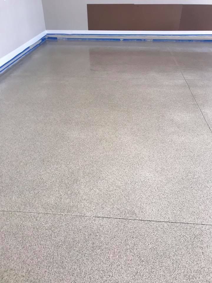 A close up of a concrete floor in a room.