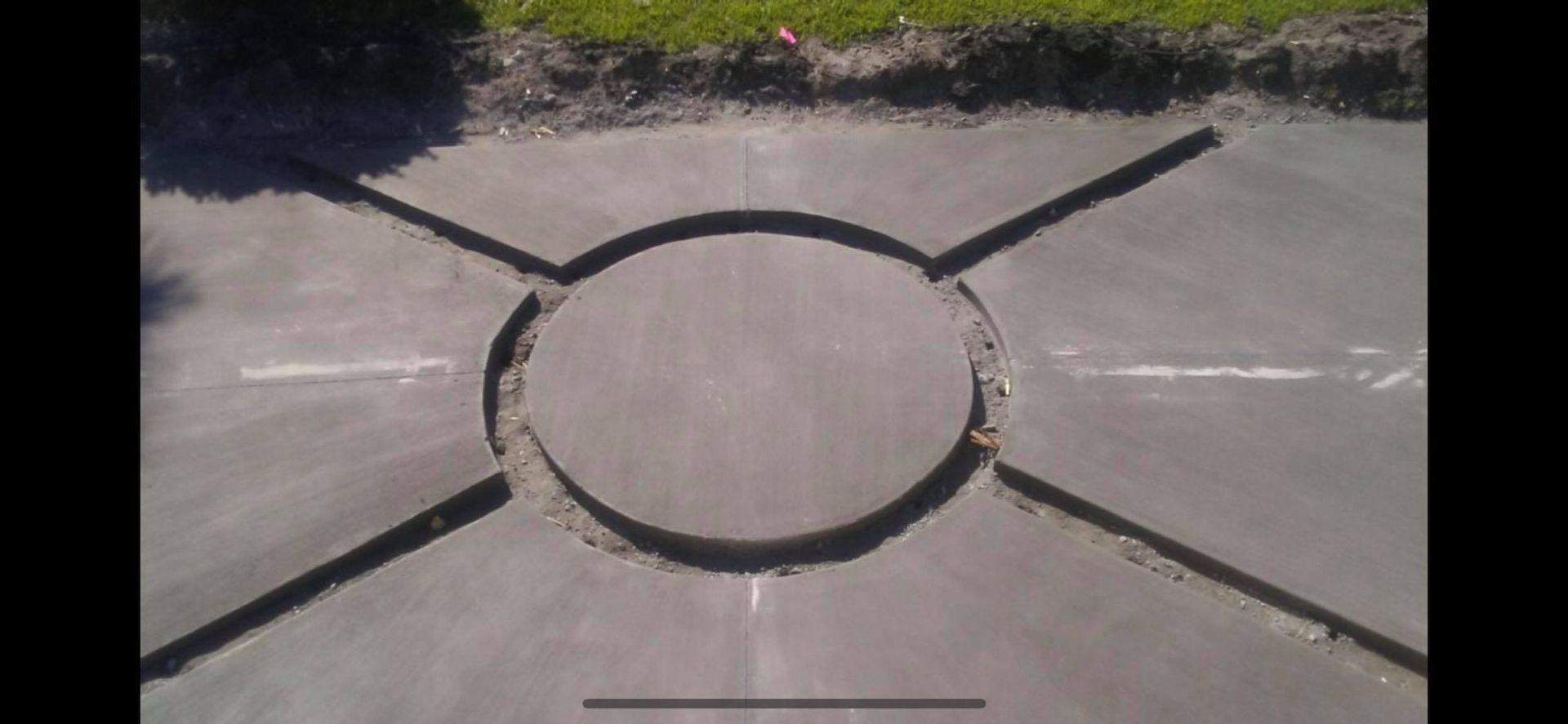 There is a circle in the middle of the road.
