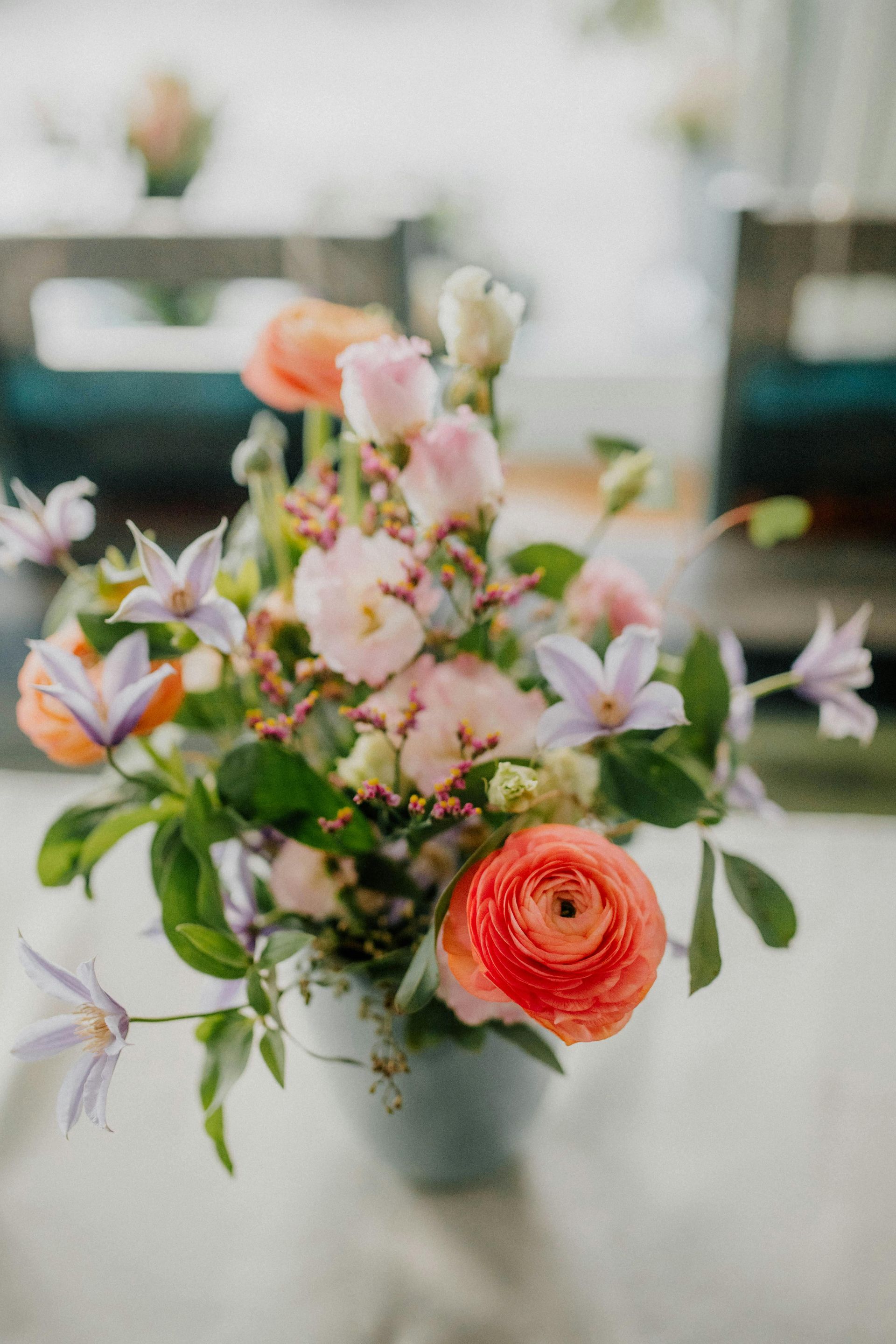 A vase filled with flowers is sitting on a table.