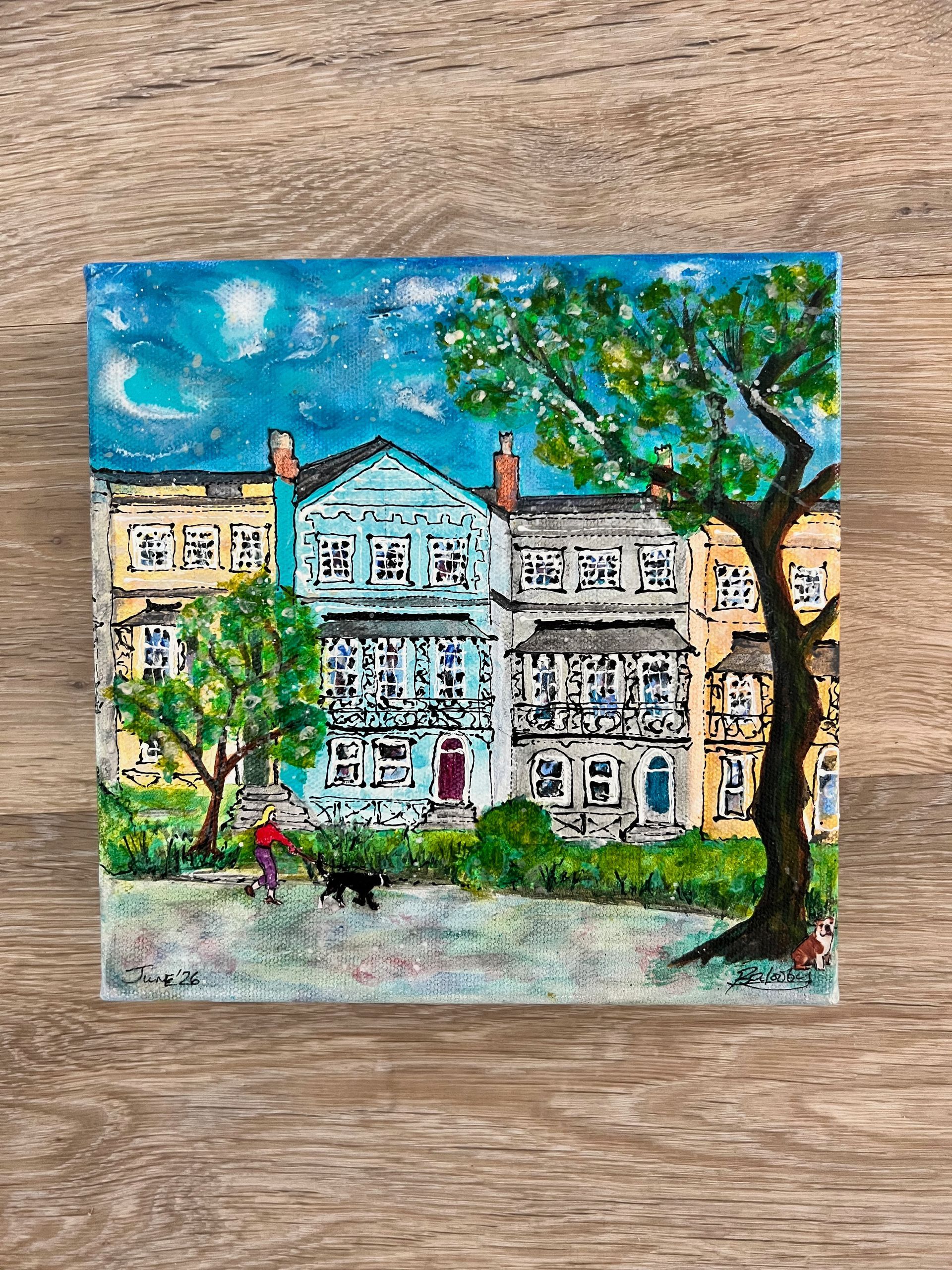 Watercolor painting of a house with many windows and an arched entryway. Green and teal accents.