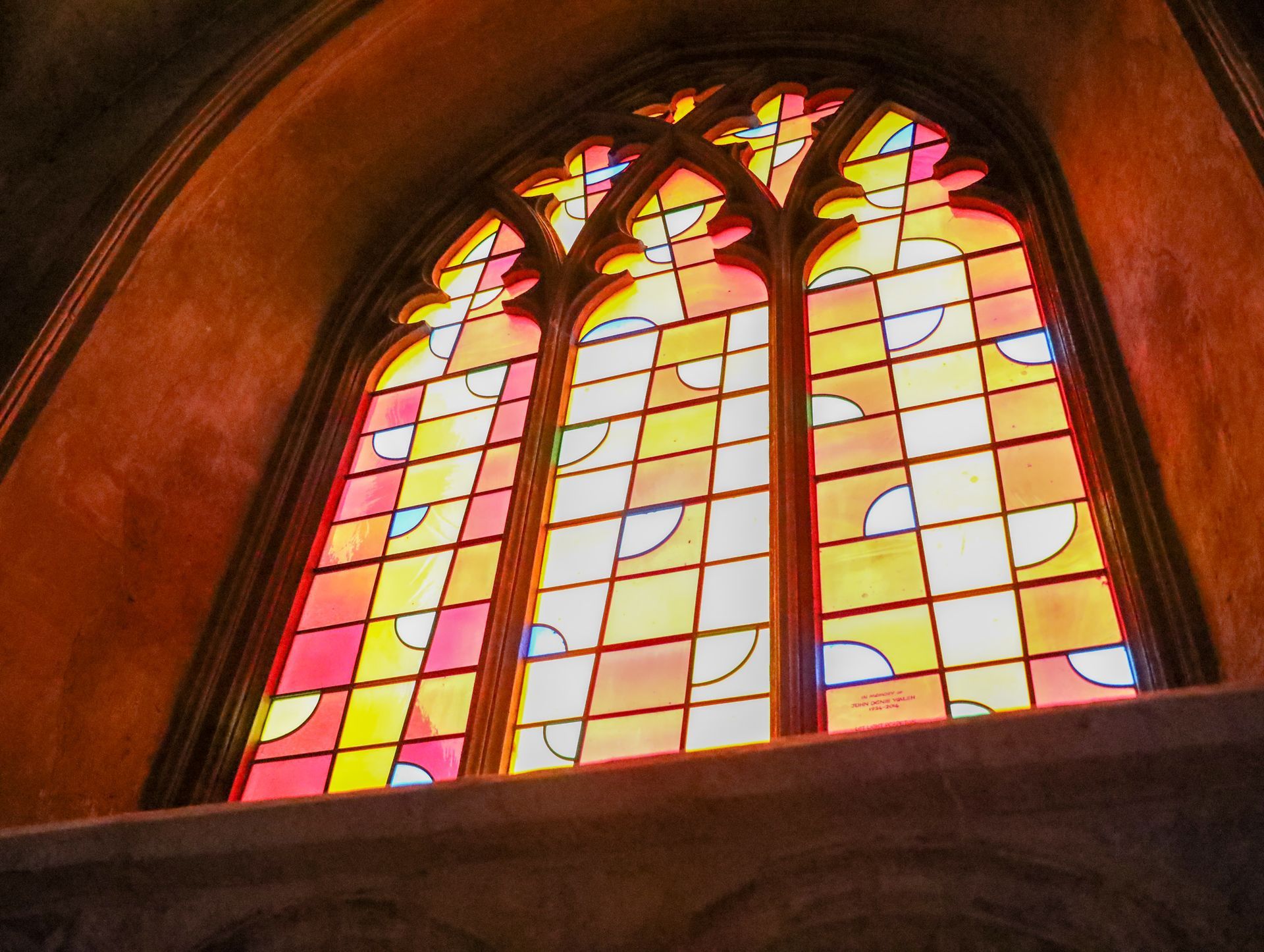 Looking up at a stained glass window in a church