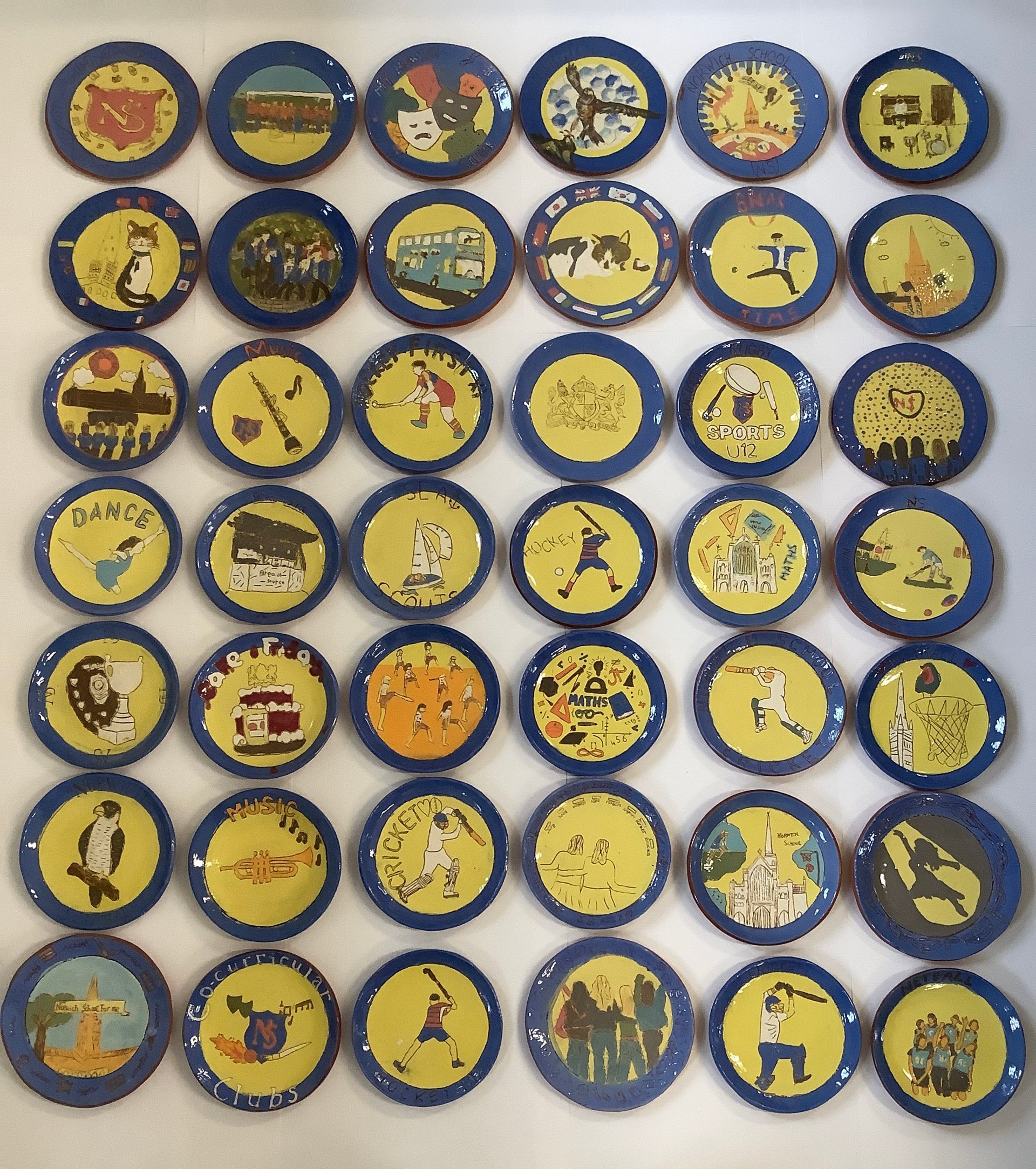 A bunch of blue and yellow circles with pictures on them