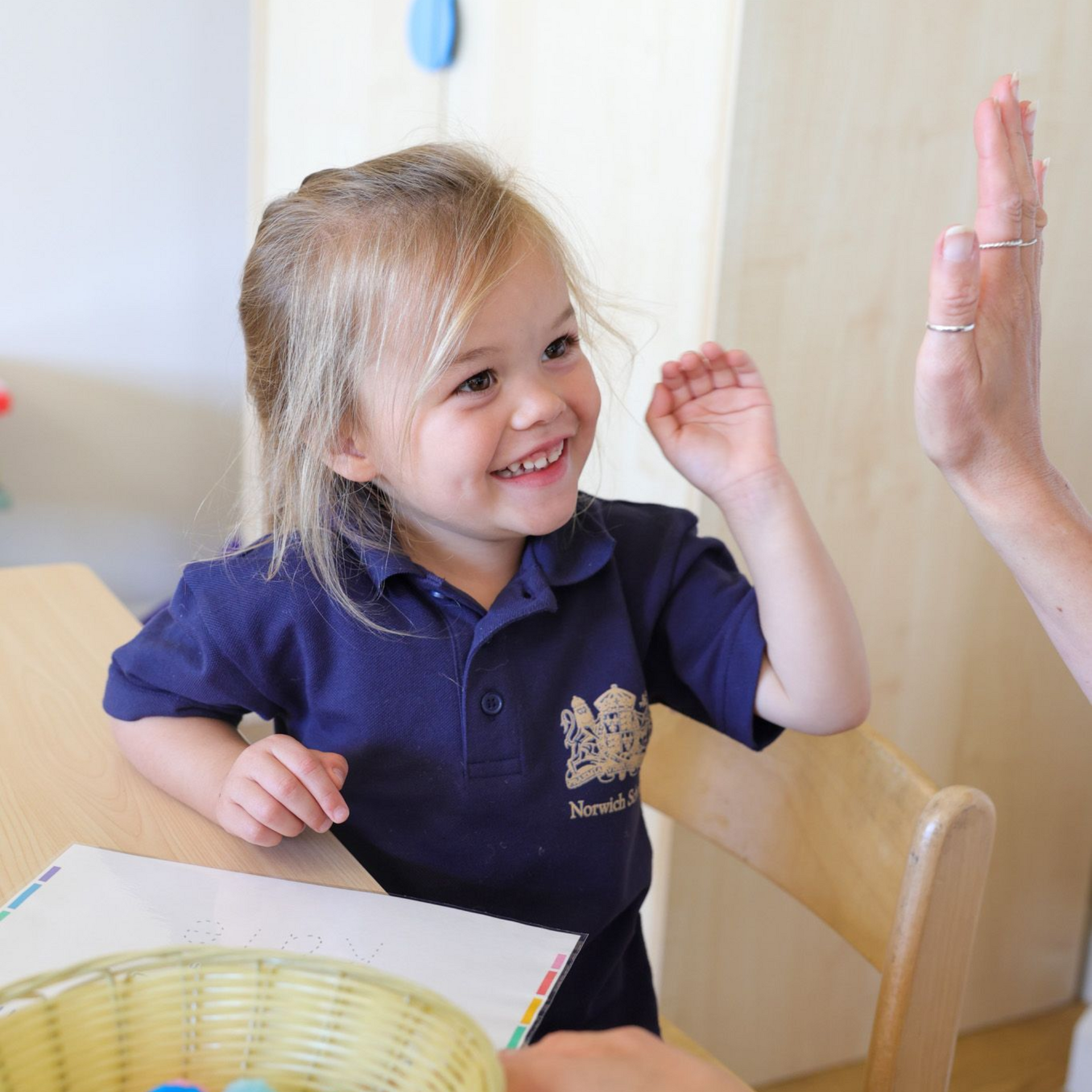 A pupil with a teacher in pre-reception.