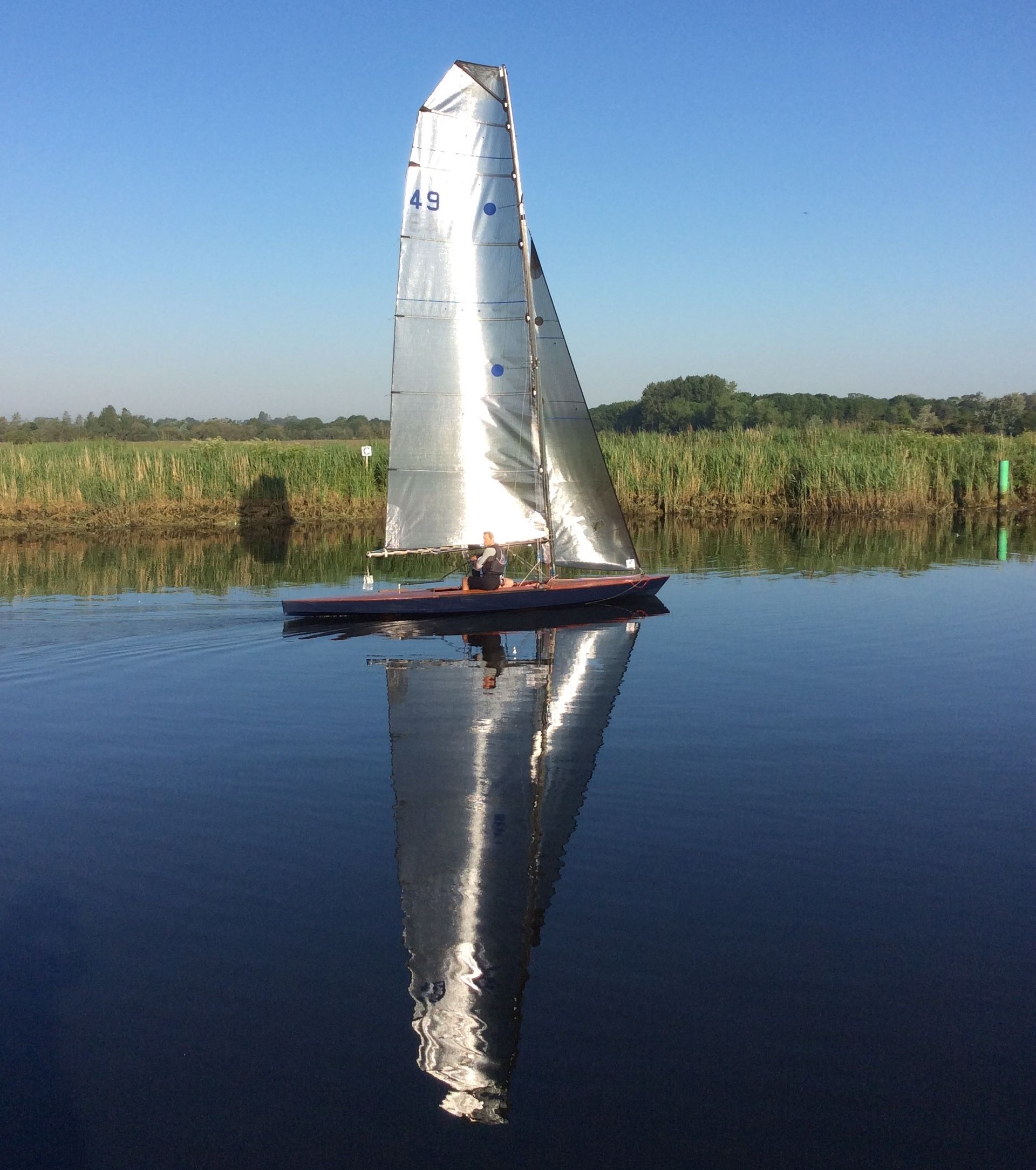 A sailboat with the number 49 on the sail