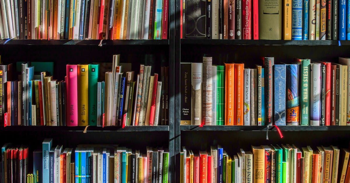 A bookshelf filled with lots of books in a library.