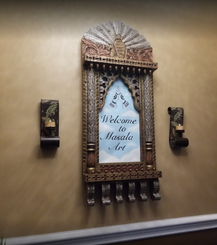 Ornate wooden sign with 