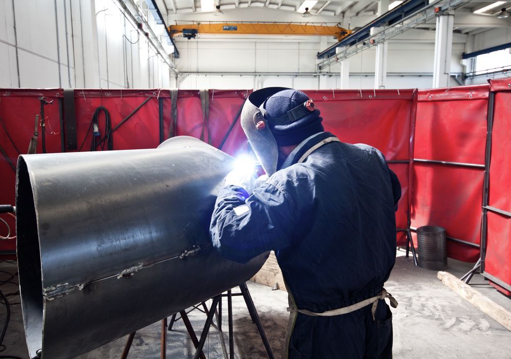 Welder Welding Large Metal Pipe — Weldcro Fabrication in Ballina, NSW