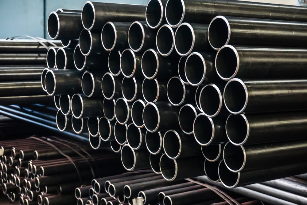 Black Metal Pipes Stacked — Weldcro Fabrication in Ballina, NSW
