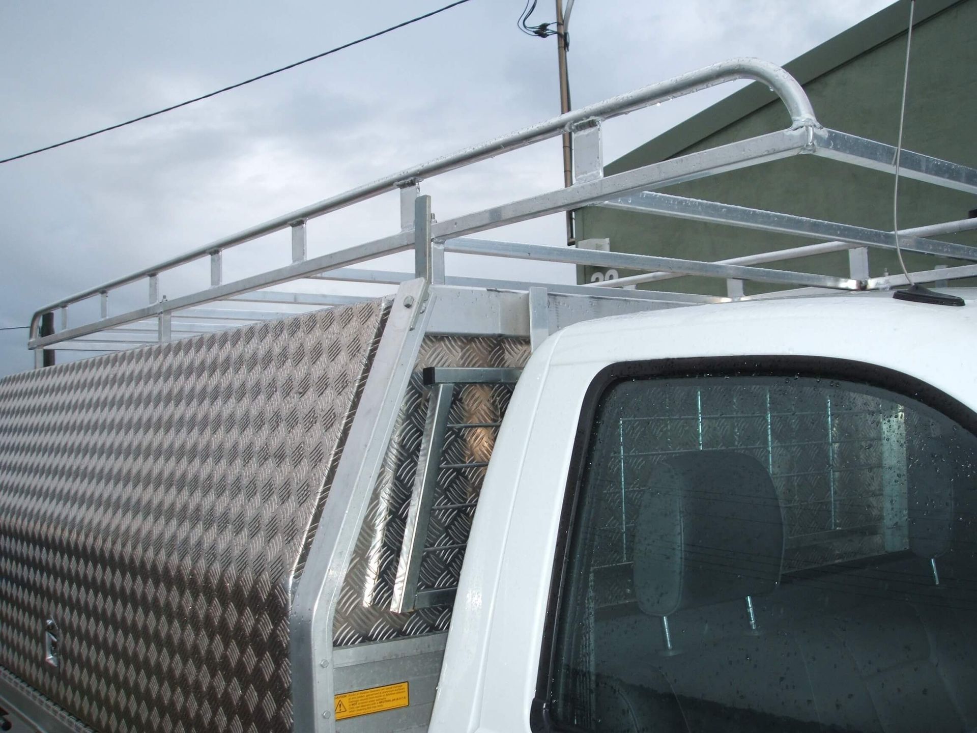White Truck with an Aluminium Roof Rack and Steel Canopy — Weldcro Fabrication in Ballina, NSW