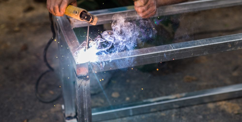 Welder Welding Metal Frame — Weldcro Fabrication in Ballina, NSW