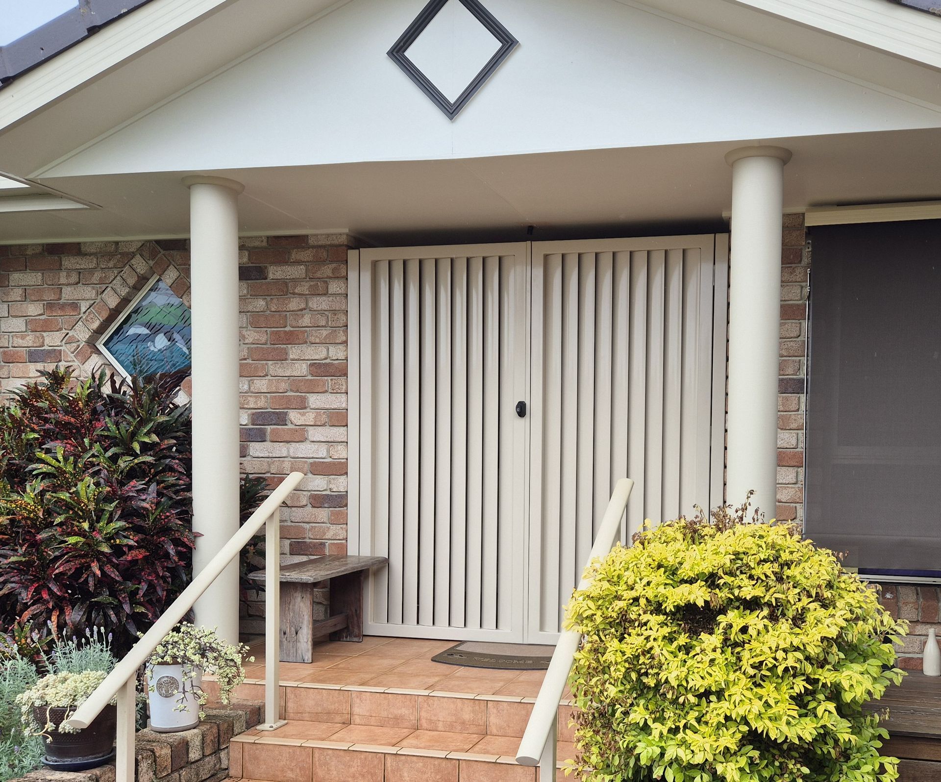 Vertical Slatted Loceked Security Gates on Front Porch Entrance — Weldcro Fabrication in Ballina, NSW