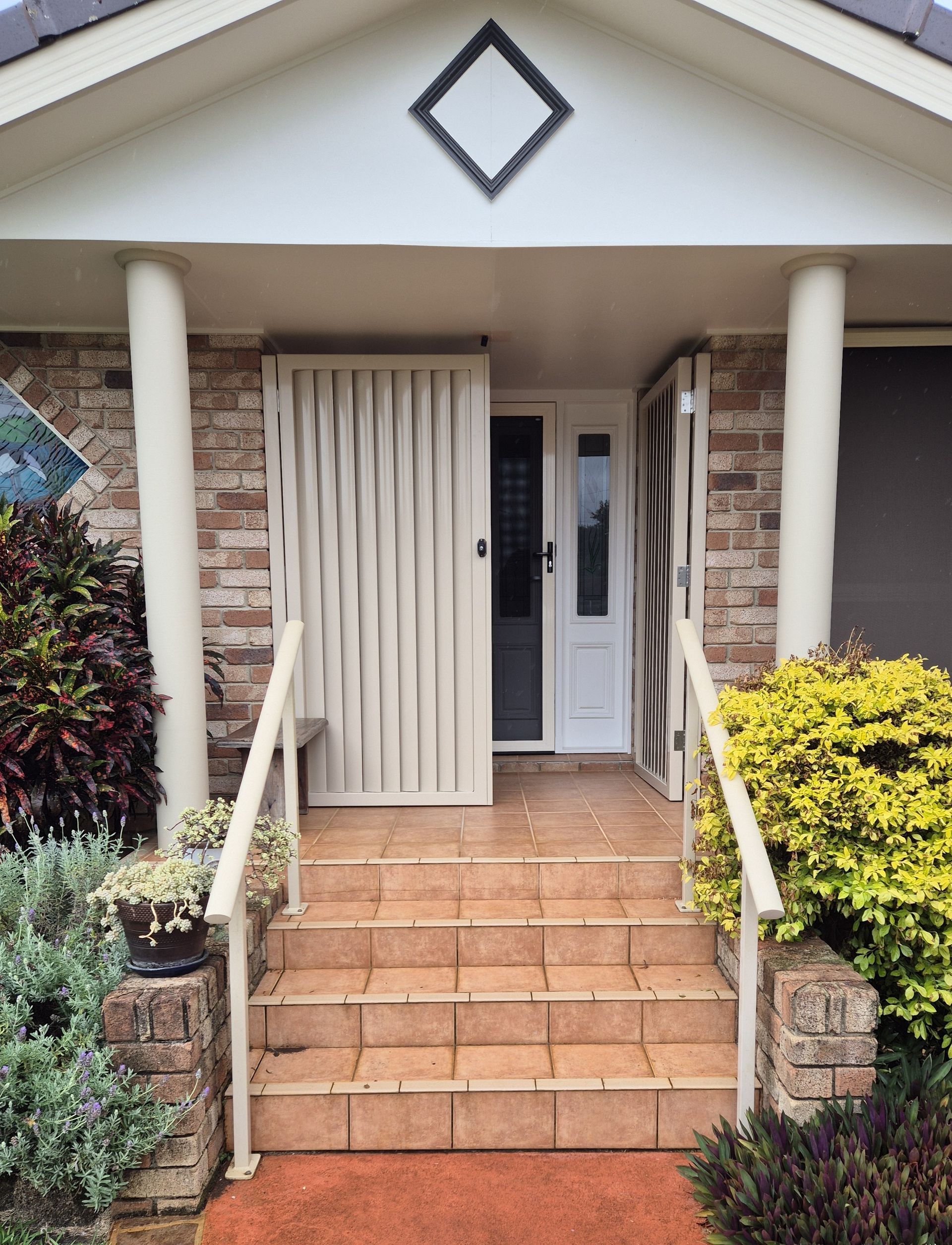 Vertical Slatted Security Gates on Front Porch Entrance — Weldcro Fabrication in Ballina, NSW