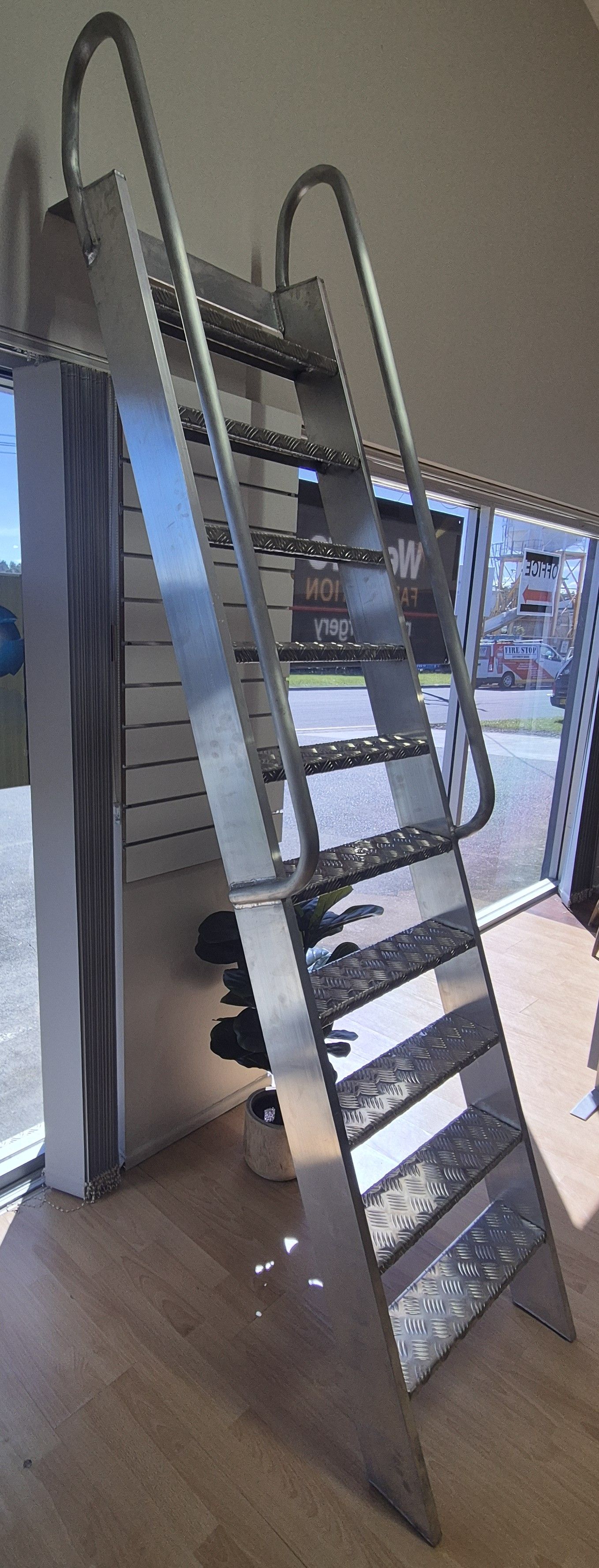 Stainless Metal Movable Staircase in a Showroom — Weldcro Fabrication in Ballina, NSW