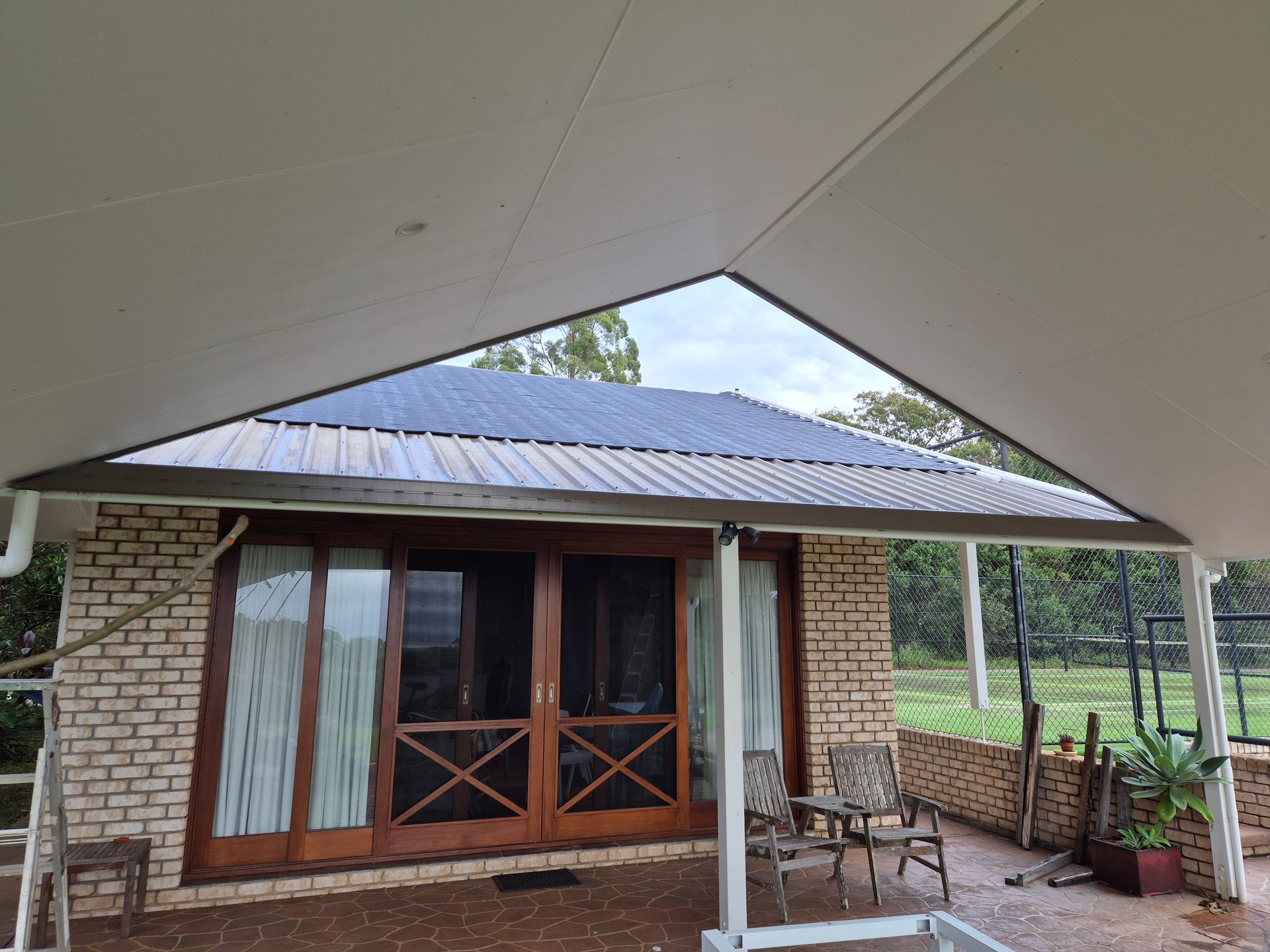 Small House with Steel Frame Porch with Wooden Double Doors — Weldcro Fabrication in Ballina, NSW