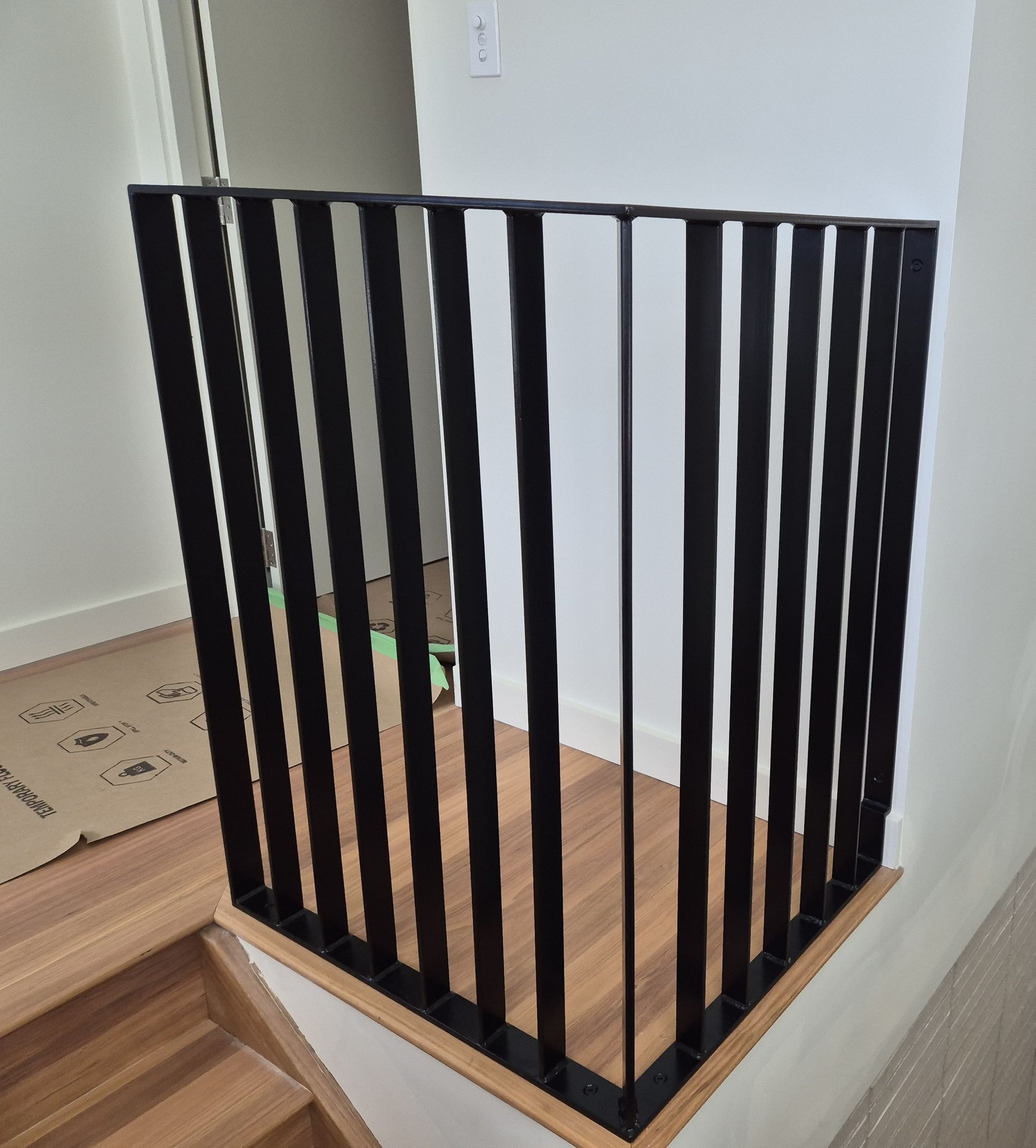 Black Metal Vertical Stair Railing — Weldcro Fabrication in Ballina, NSW