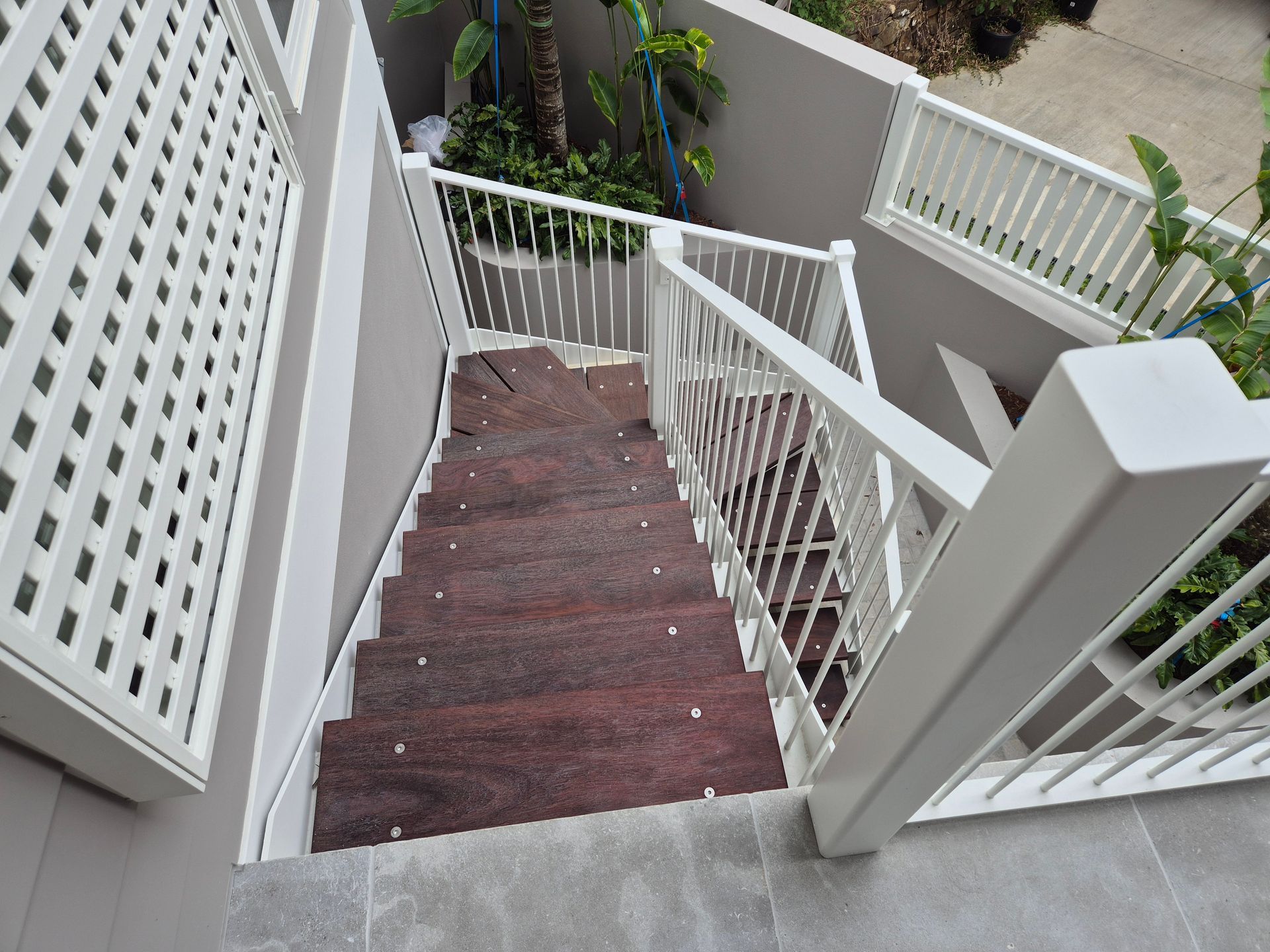 Steep Outdoor Stairway with White Metal Railings — Weldcro Fabrication in Ballina, NSW