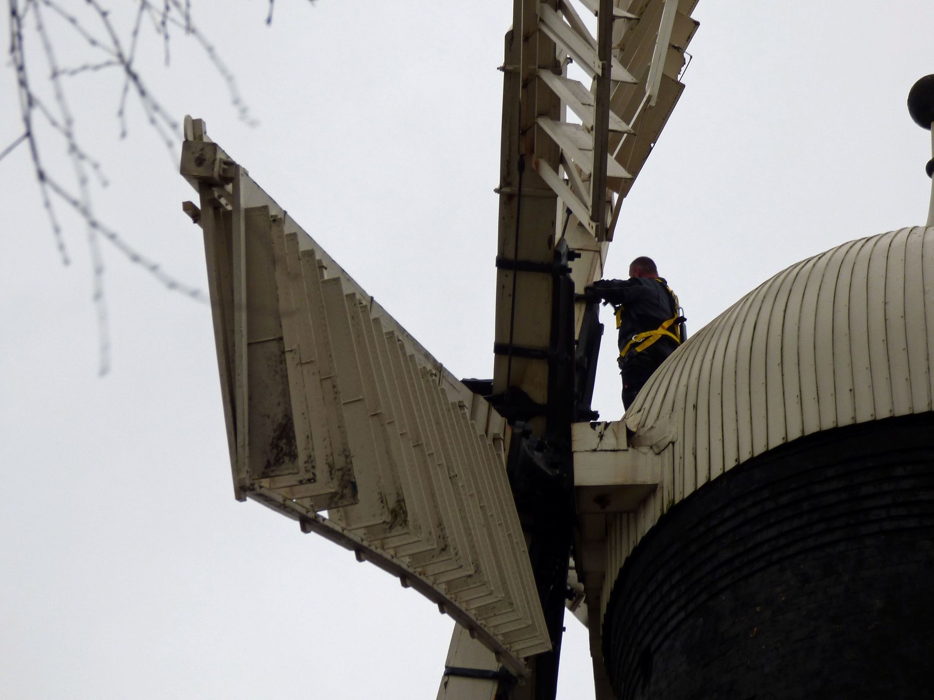 A man is climbing up the side of a building