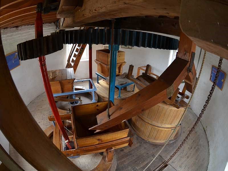 An aerial view of the inside of a wooden windmill.