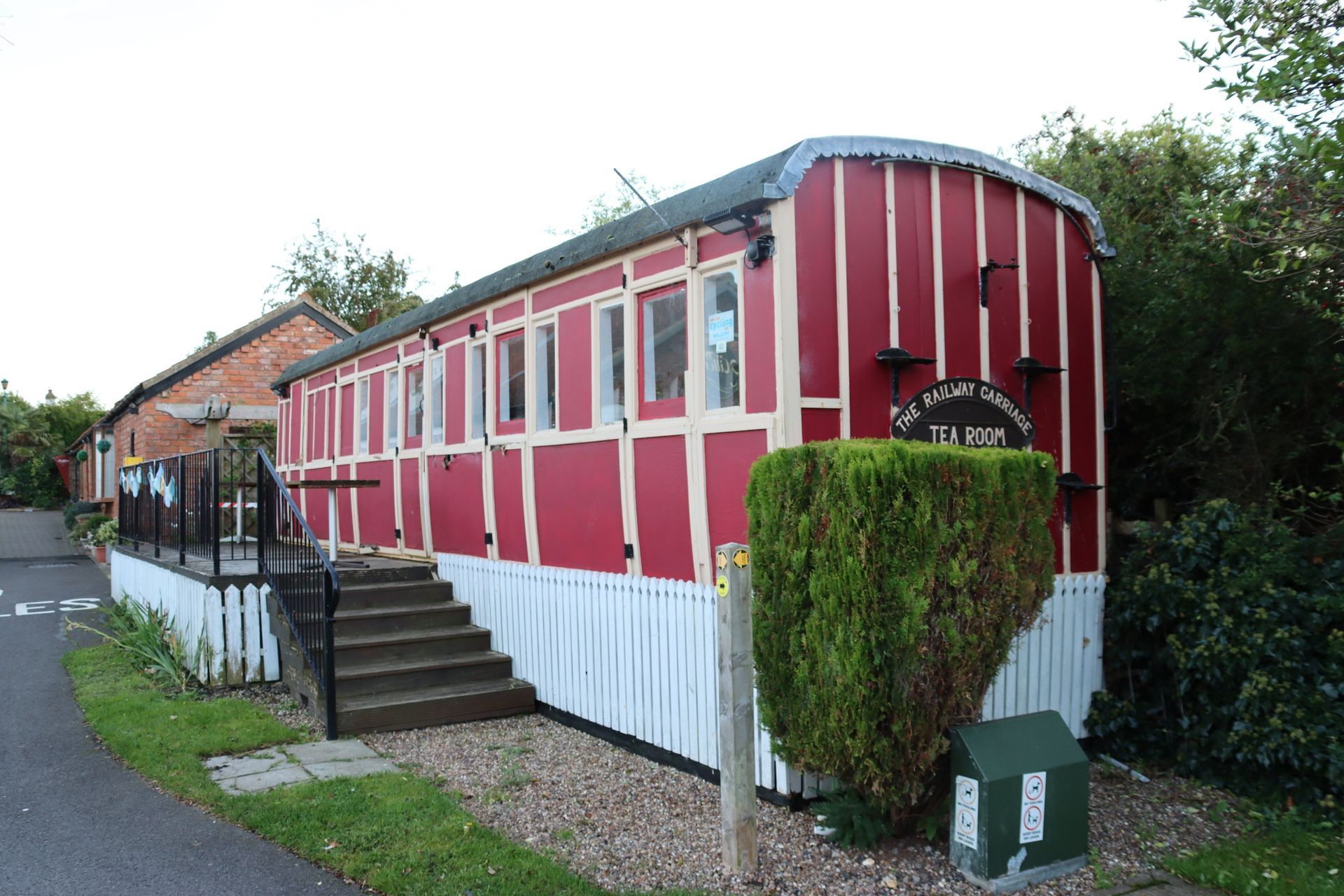 A red and white building with stairs leading up to it