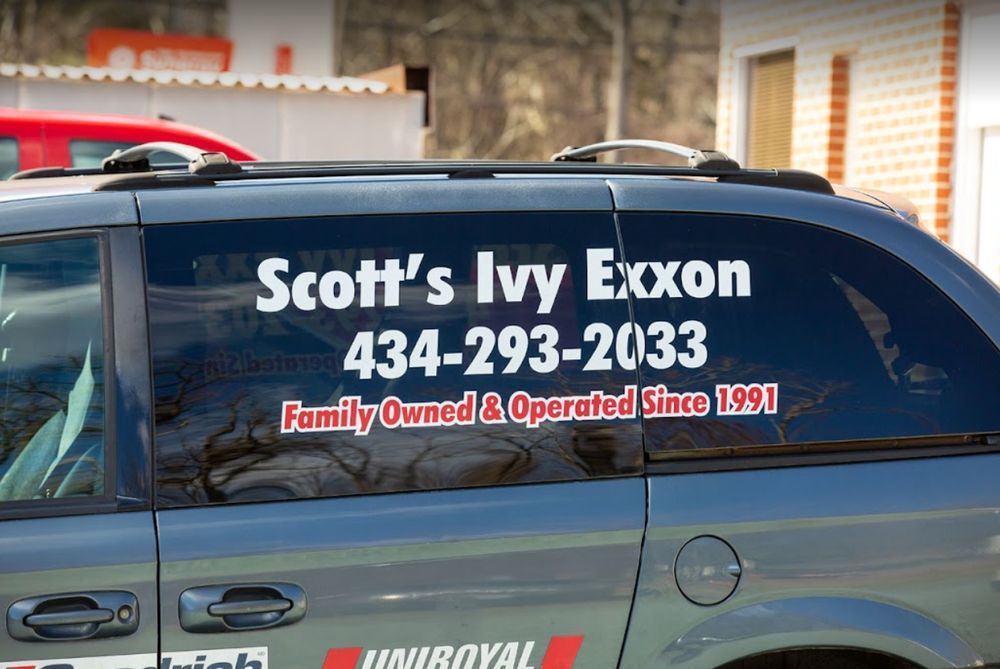 Service truck with phone number and sign | Scott's Ivy Exxon Automotive & Tire