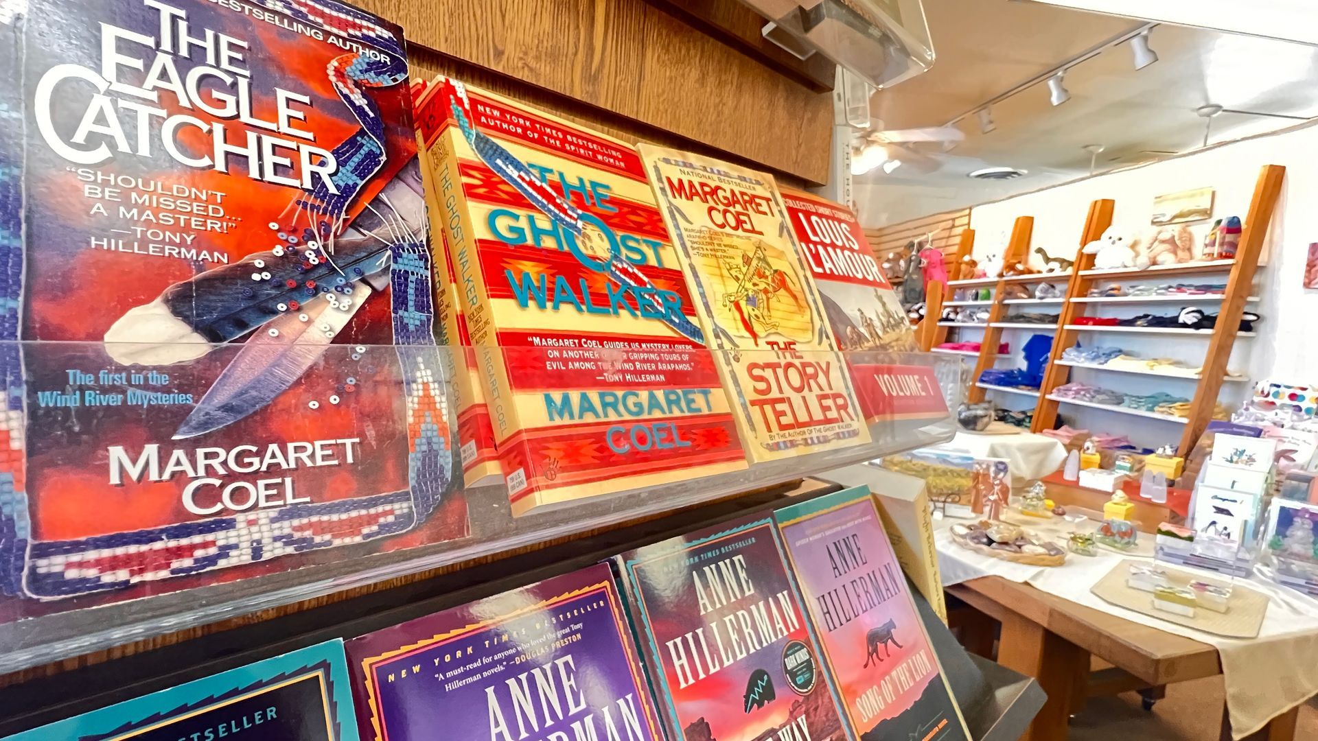Bookstore display with colorful stacks of Margaret Atwood novels on a shelf.