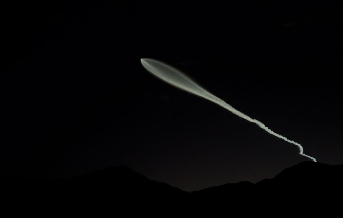 SpaceX's Falcon 9 rocket illuminates the night sky over Borrego Springs during the Starlink 9-2 mission.