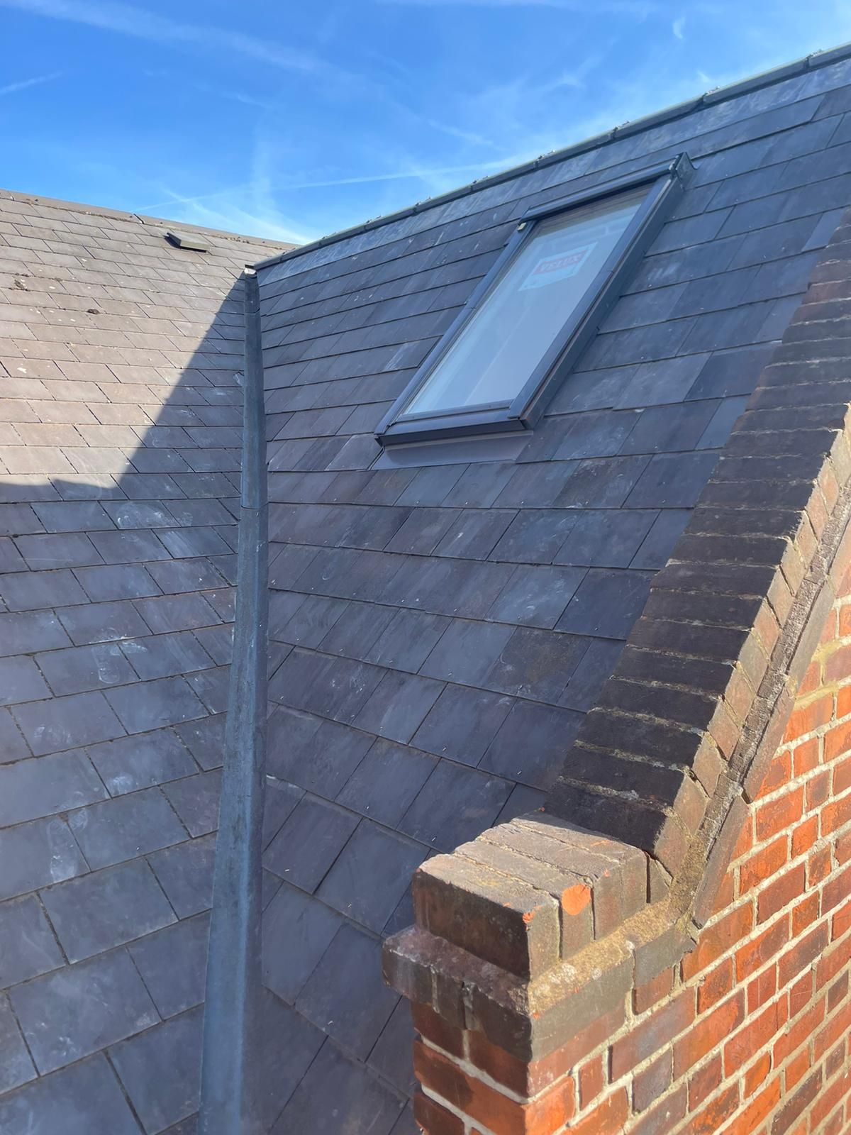 Slate roof with velux window