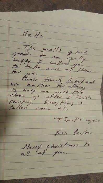 Handwritten holiday letter on lined paper, slightly blurry, with a “Hello” greeting and “Happy Christmas” closing.