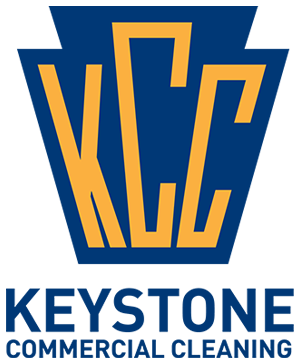 Keystone Commercial Cleaning logo with blue and gold stylized letters and company name text